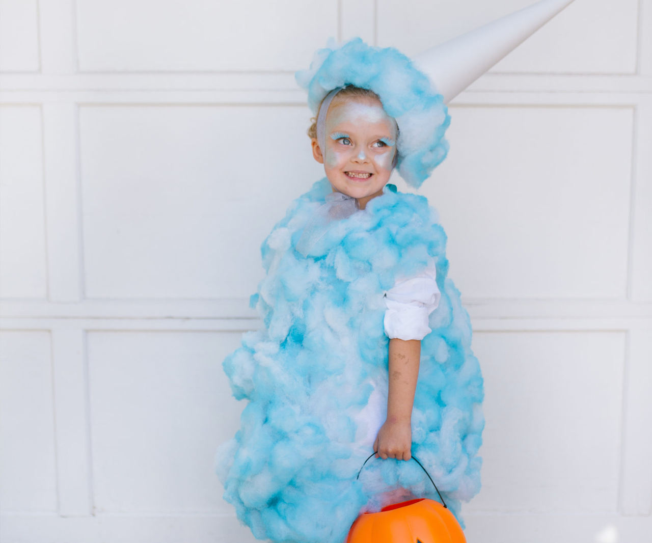 Child dressed up in a cotton candy costume.