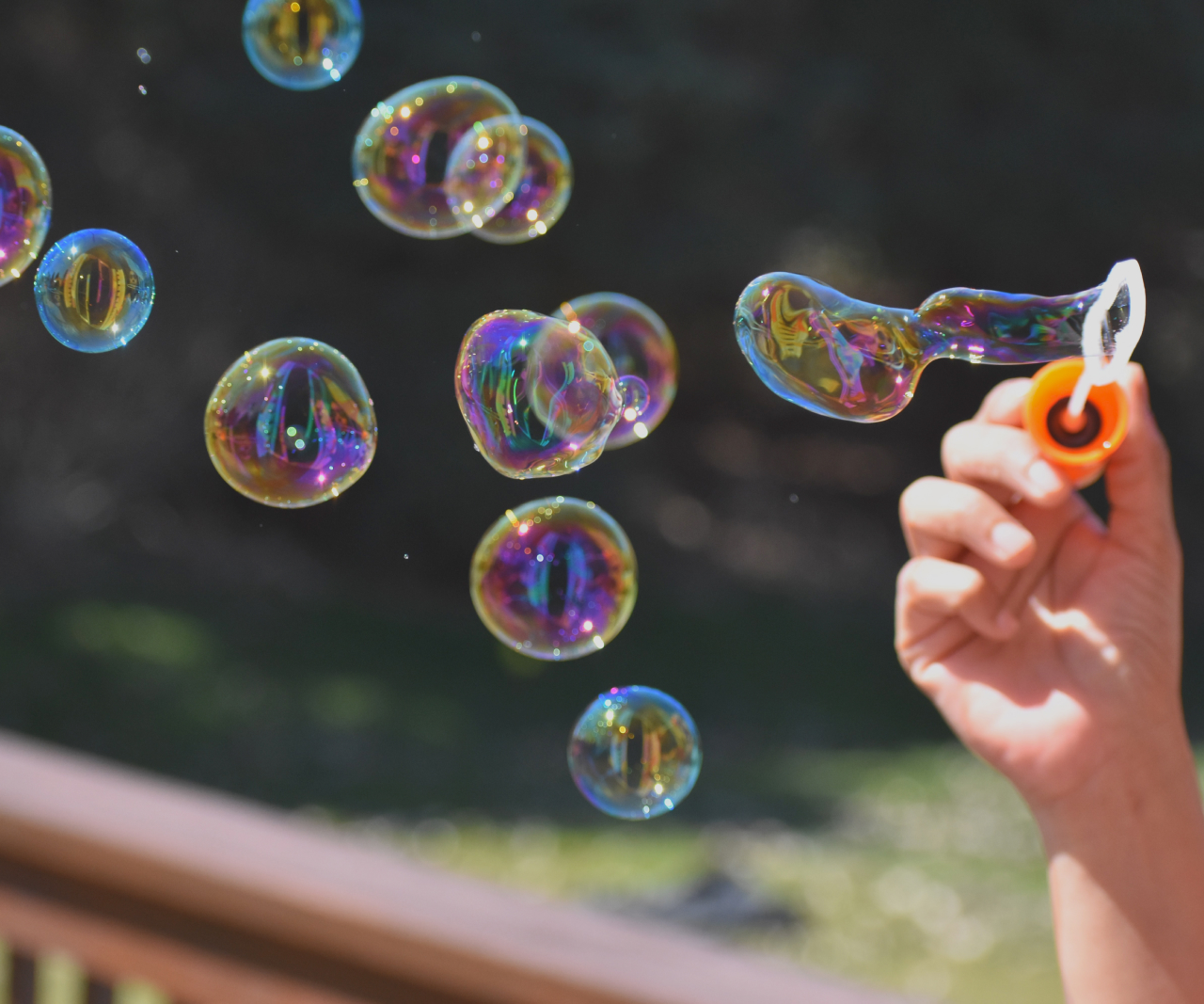 Person blowing bubbles.