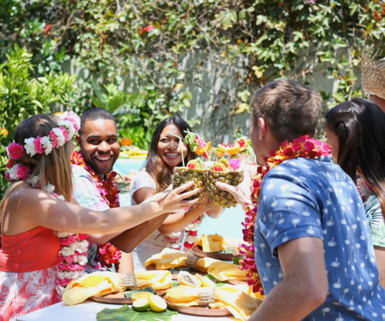 People outside at a luau party.