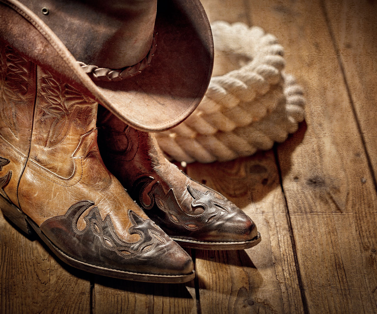 Cowboy boots, hat and rope,