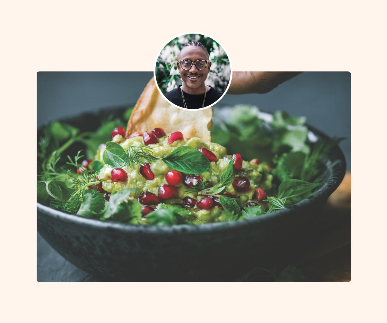 Guacamole in a bowl with pomegranate seeds sprinkled on top.