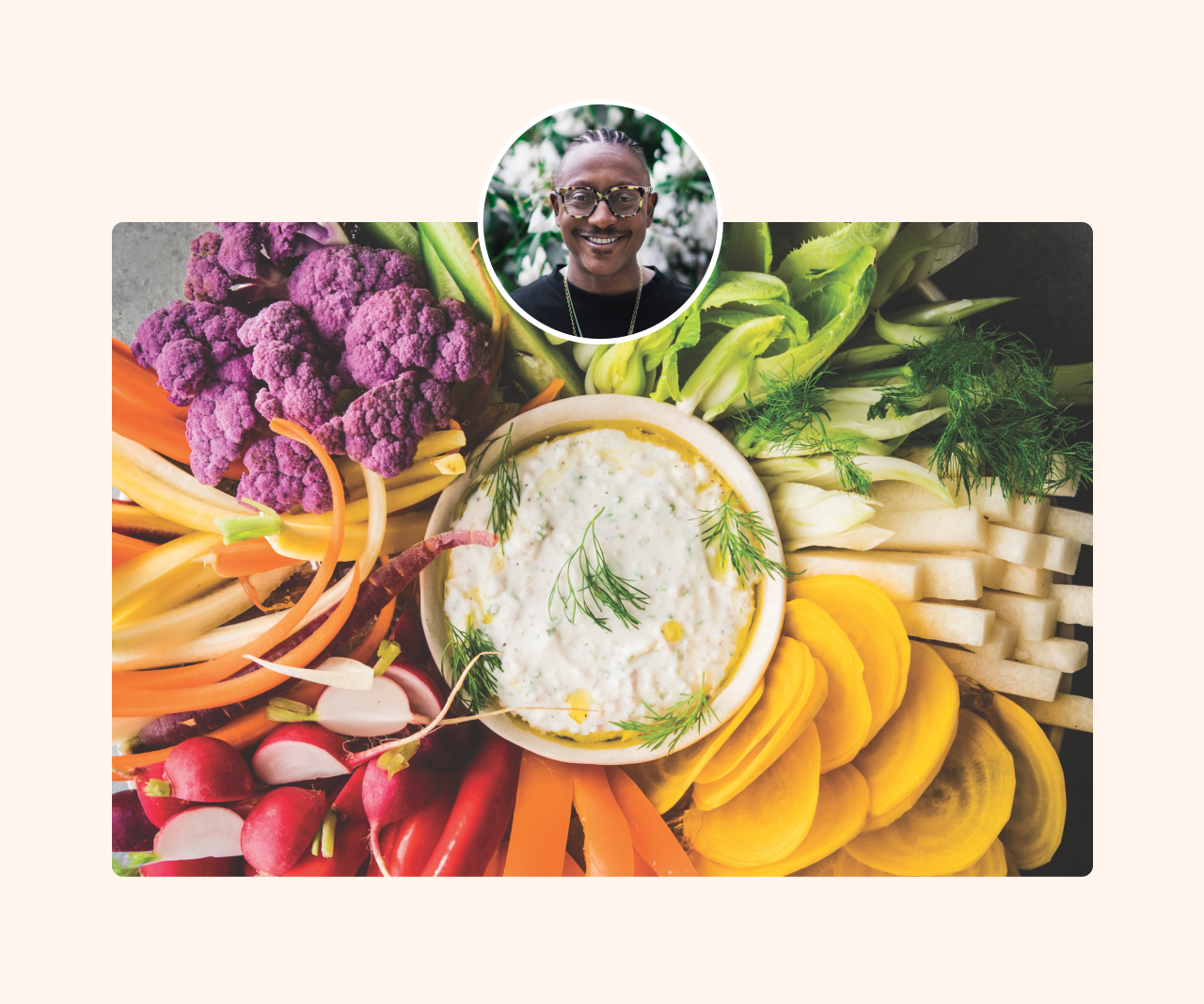 A vegetable platter with a bowl of dip in the center. An image of Gregory Gourdet smiling is centered at the top.