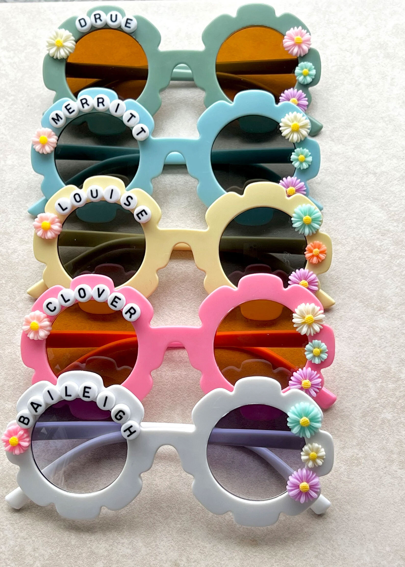 Personalized sunflower-shaped glasses.