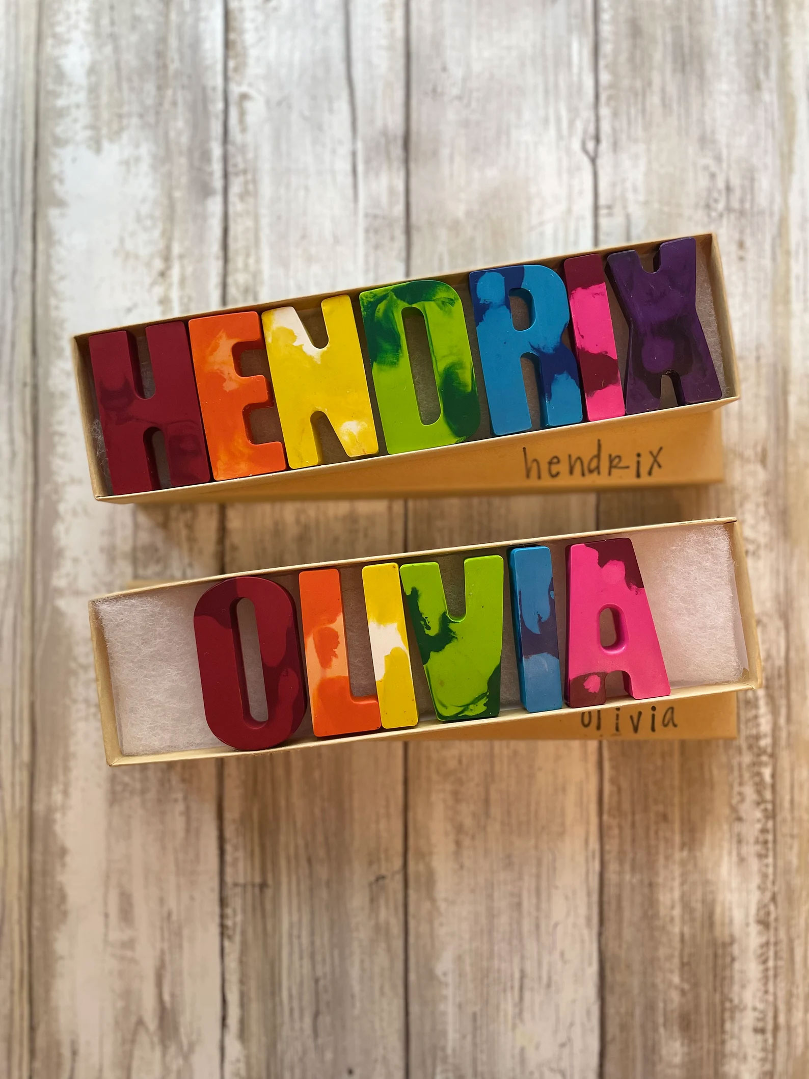 Crayons shaped as letters spelling out "Hendrix" and "Olivia."
