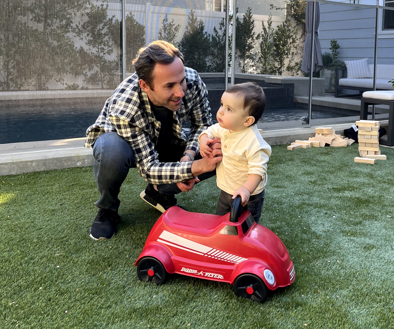 Dad and baby with toy car.