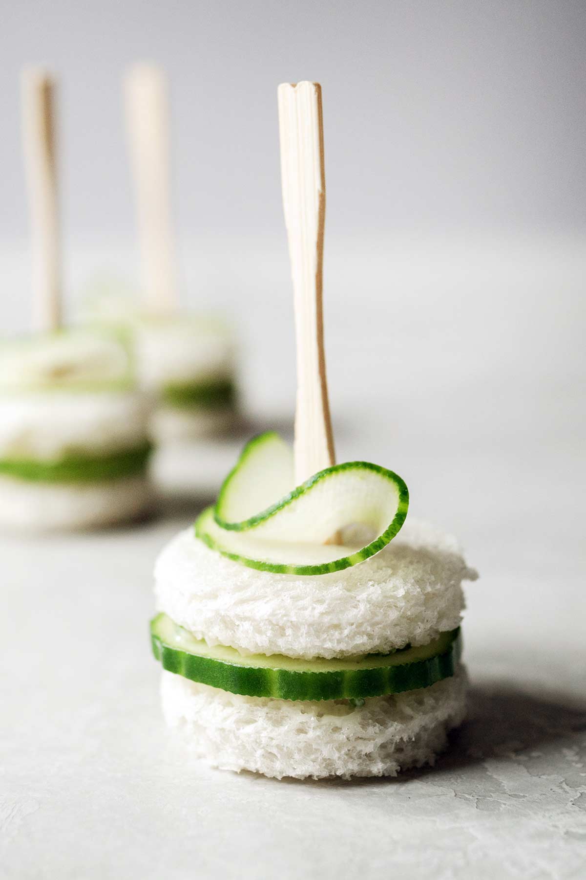 A close-up of a cucumber finger sandwich.