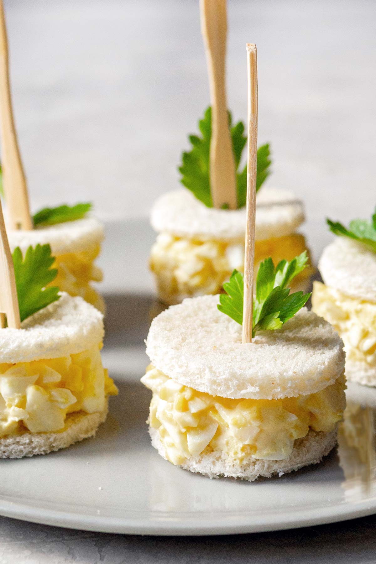 A close-up of egg salad finger sandwiches.