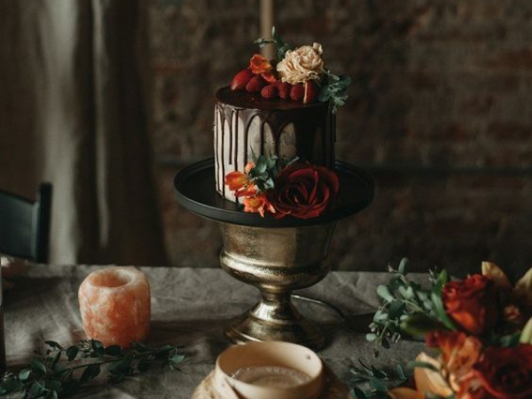 Chocolate drip cake with fall florals as accents (image from Pinterest).