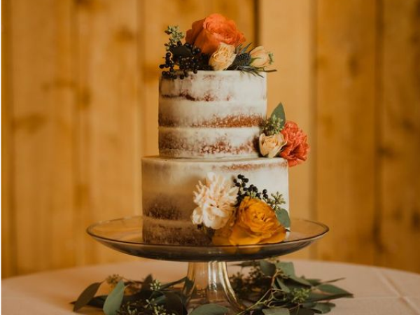 Naked cake with orange fall florals as accents (image from Pinterest).