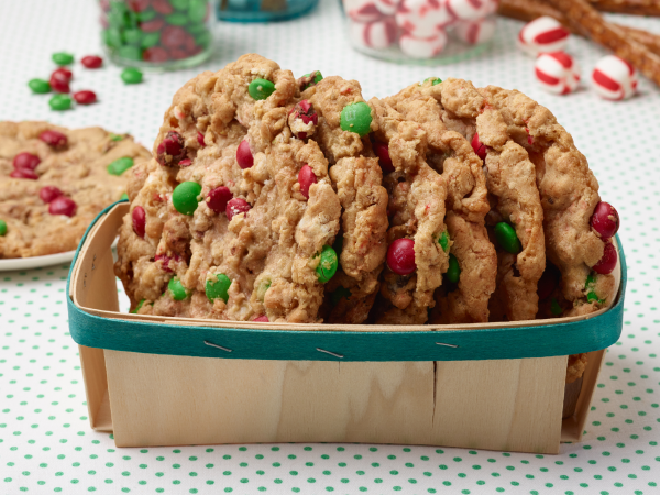 Holiday monster cookies in a basket.