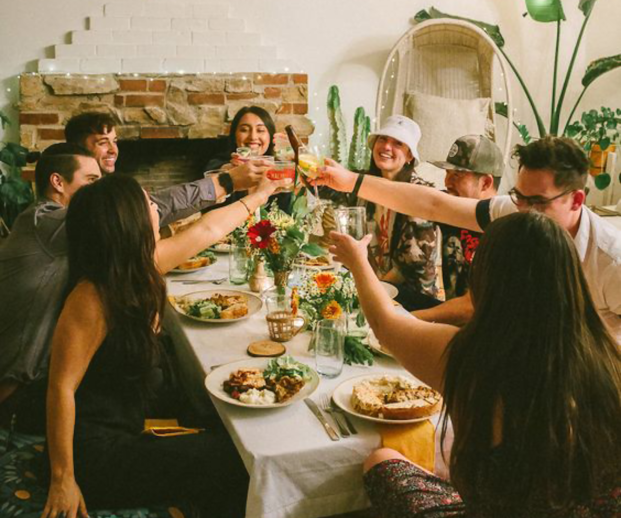 People drinking wine at a party.