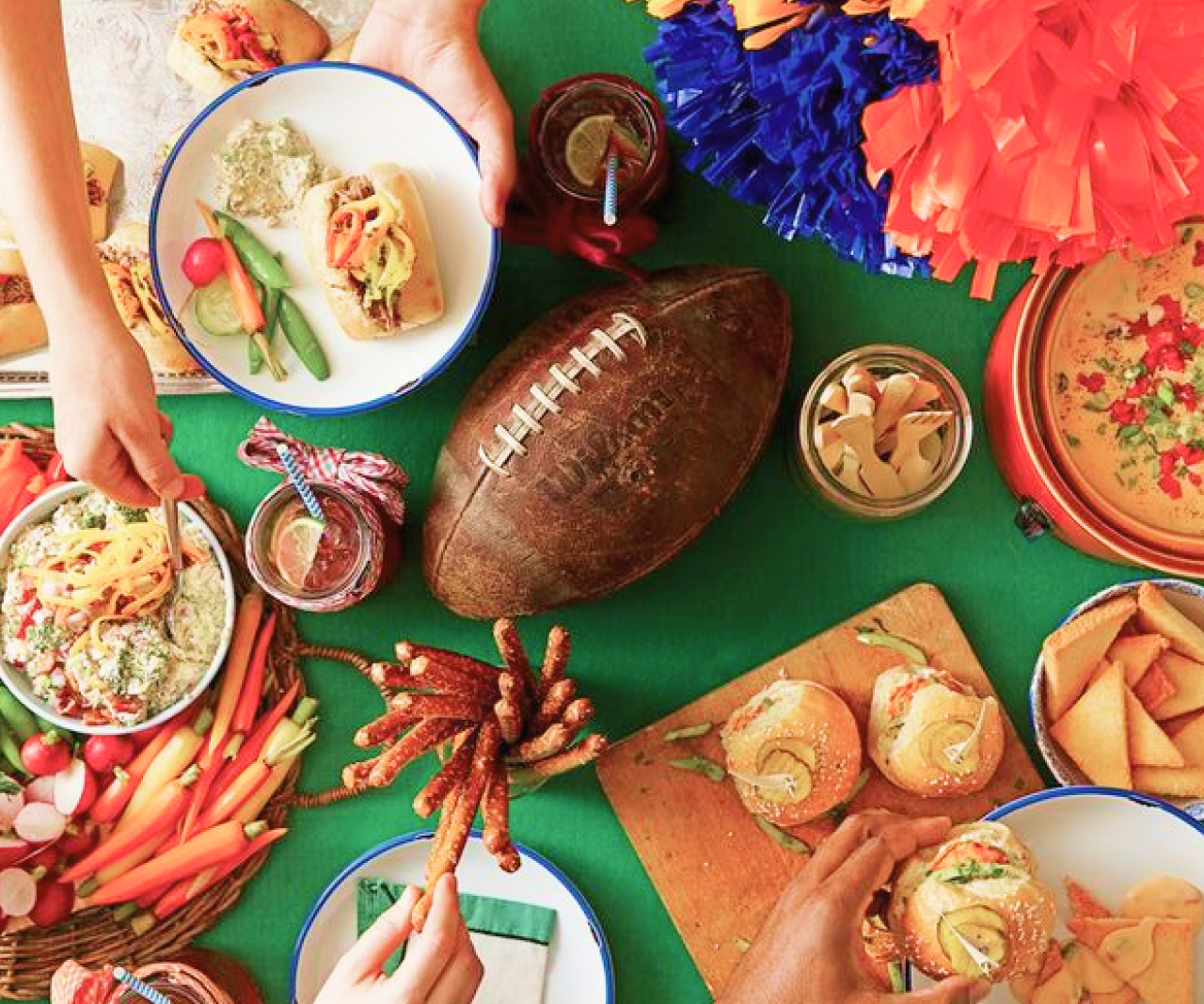 A bird's-eye view of a table full of game day snacks.