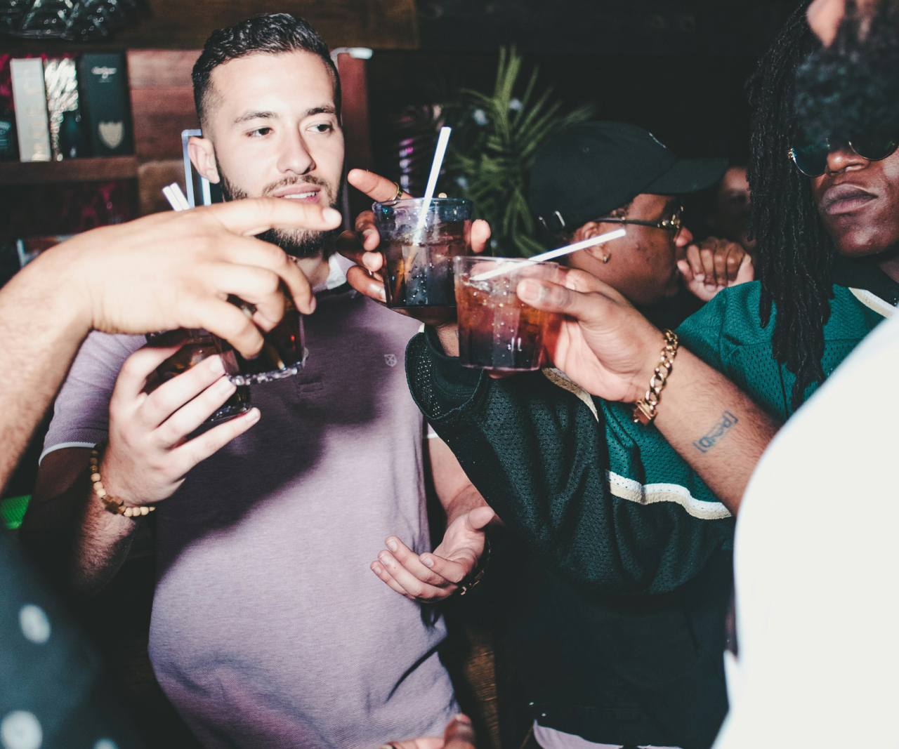 A group of men raising glasses.