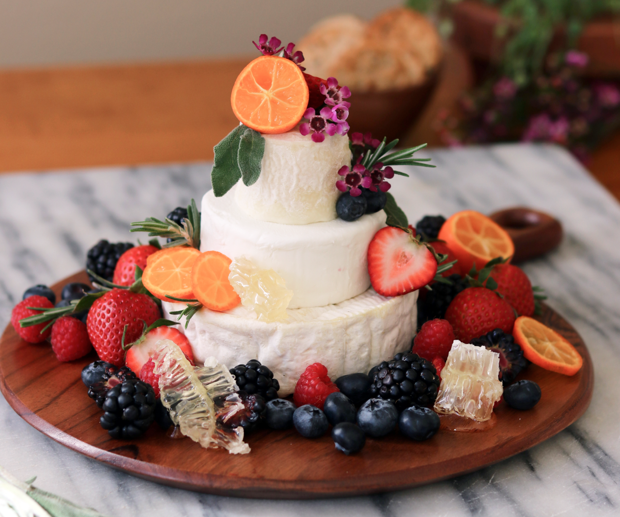 Move over charcuterie board! This tiered cheese “cake” is the hot new appetizer every host should know about